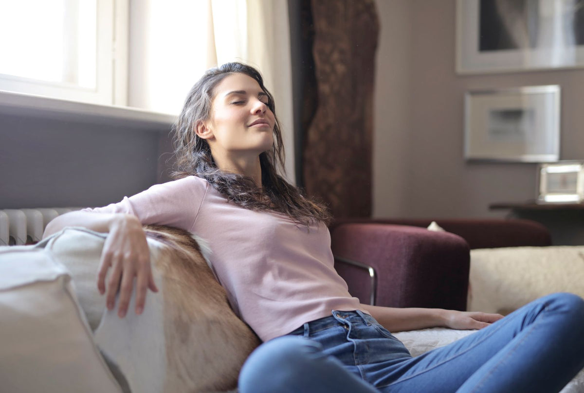 Woman relaxing on the sofa at home at the end of the day